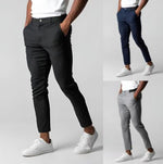 Slim-fit business trousers shown in black, gray, and navy with button waist