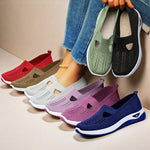 Set of knit flat slip-on shoes in red, tan, purple, and blue with oval cutouts