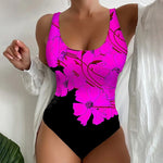 Women's one-piece swimsuit back view, magenta purple floral print with black bottom