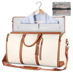 Foldable white waterproof duffel bag with brown trim, open interior, shoulder strap