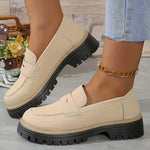 Women’s matte beige flat loafer shoes with round toe, buckle strap, and thick tread sole