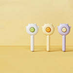 Cat and dog grooming massage brushes in green, yellow, and purple with round buttons
