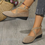 Khaki suede wedge cross-strap flat pumps, side view with back strap and wedge sole