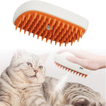 White pet steam spray grooming comb with dense orange bristles, angled front view