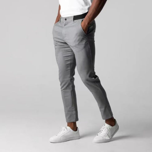 Light gray slim fit business suit pants with button waistband and straight tapered legs