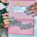 Iridescent rhinestone medium square nails set shown on fingertips