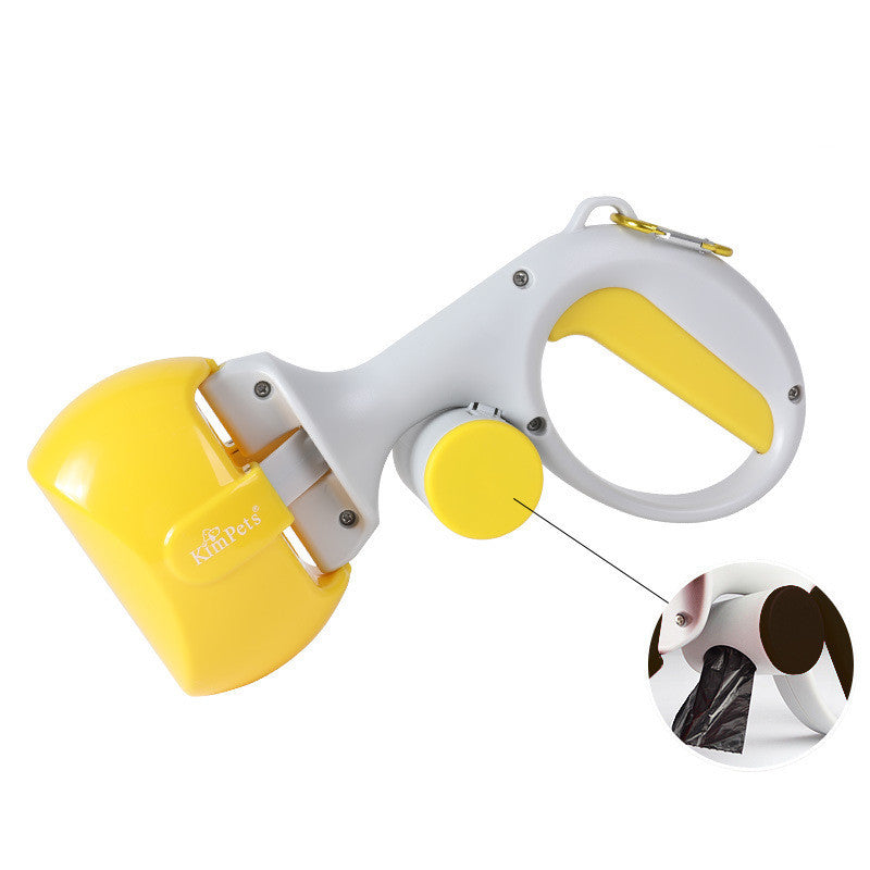 Dog waste scooper with yellow bin and white handle, with black waste bag visible.