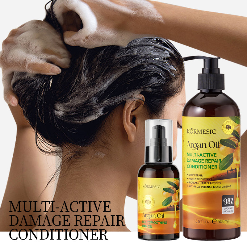 Argan oil hair oil bottles with pump, shown with hand applying to dark hair