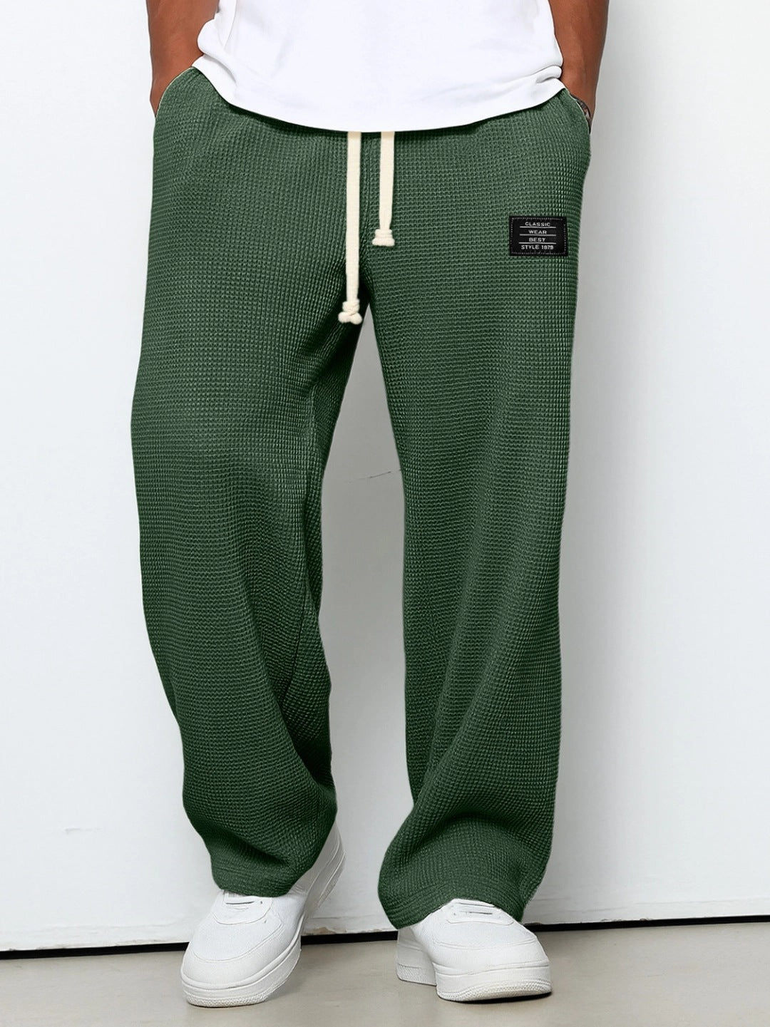 Waffle loose drawstring trousers in dark green with straight, relaxed fit