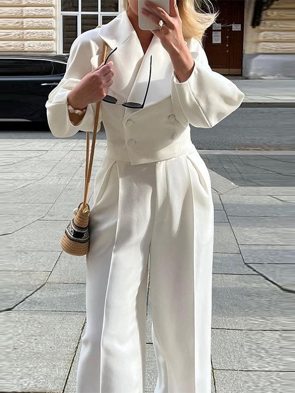White short lapel jacket with long puff sleeves and matching high-waist trousers