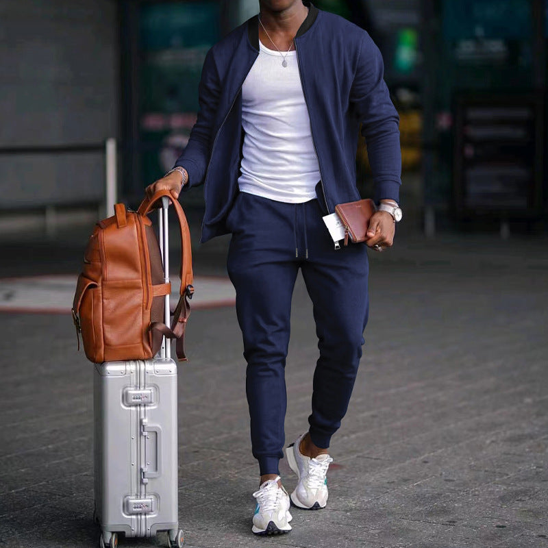 Men's zip-up long sleeve jacket and drawstring sweatpants set in dark blue, tapered legs