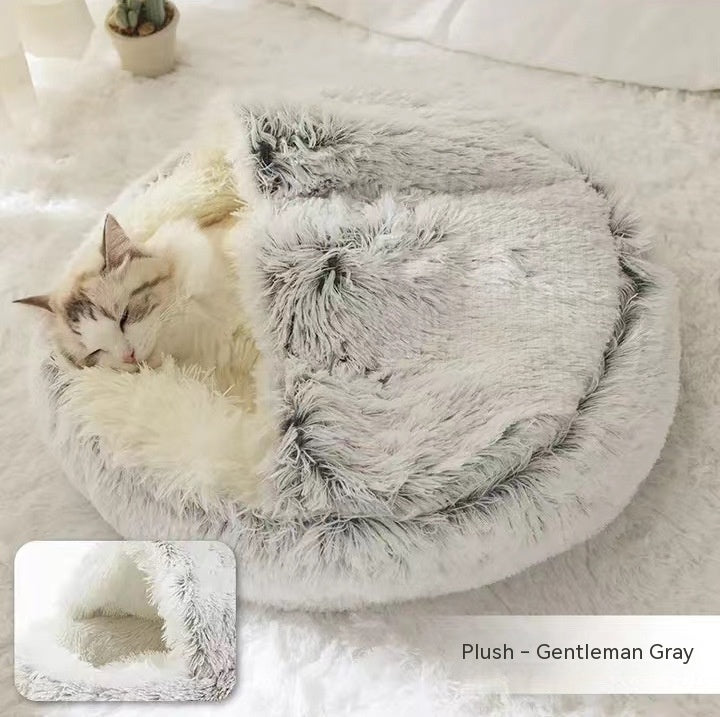 Round plush pet bed with cave opening; gray fuzzy exterior with cream inner cushion