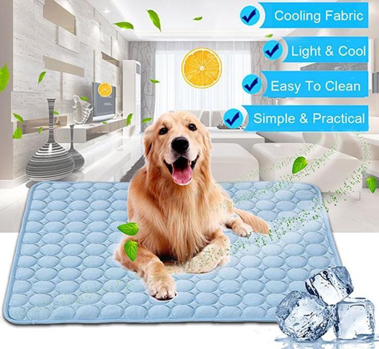 Blue ice silk cooling pad with pebble pattern; golden dog lying on top