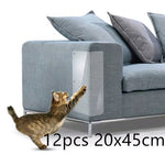 Translucent PVC sofa guard pad on blue sofa armrest with cat clawing