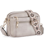 Crossbody bag in light gray with triple zippers and floral patterned embroidered strap