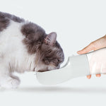 White 2-in-1 dog water and food bottle with dispenser spout