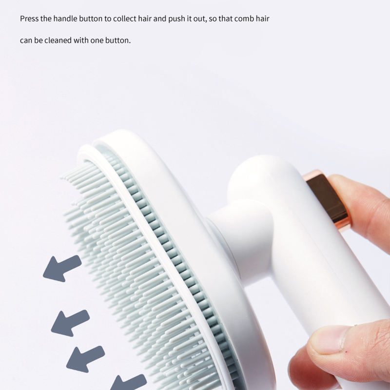 Pet hair removal comb showing press handle for collecting hair in one motion