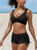 Black bandeau bikini set with scooped crisscross top and ruched tie-side cheeky shorts