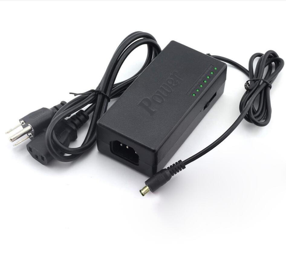 Universal power adapter with LED indicator lights and attached power cord, DC barrel plug