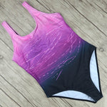 One-piece swimsuit, purple patterned top with dark bottom, scoop neckline