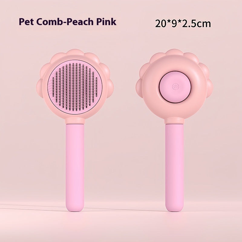 Self-cleaning pet grooming comb with spray, pink round pin brush head and button.
