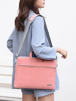 Pink PU laptop tote with top handle and shoulder strap, front zip pocket.