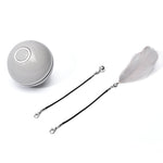 Gray LED rolling cat toy ball with black tether straps and gray feather