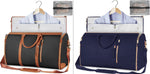 Two duffel bags on hangers: black and navy with tan strap trim and zipper tassels