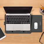 Laptop sleeve bag in dark PU leather, flat lay with laptop and mouse inside