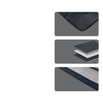 Dark laptop sleeve close-up with stitched edge and layered compartment panels