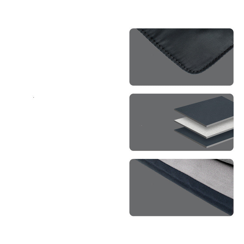 Dark laptop sleeve close-up with stitched edge and layered compartment panels