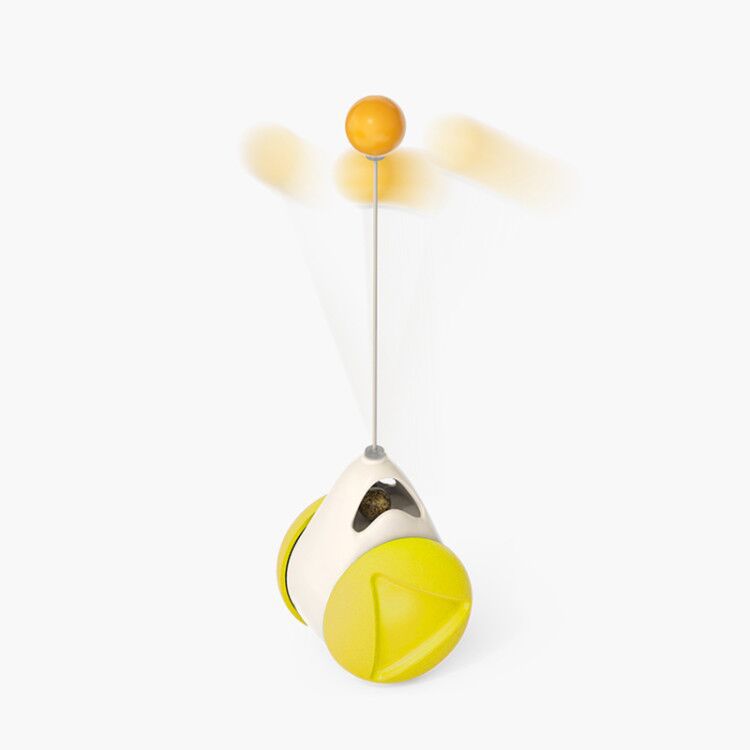 Cat rotating windmill toy with yellow ball and white cord, hanging on oval housing