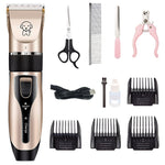 Beige pet grooming clipper kit with comb guards, scissors, brush, and USB charging cable.