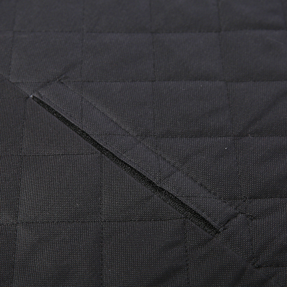 Black dog car seat cover close-up of quilted panels and folded seam edge