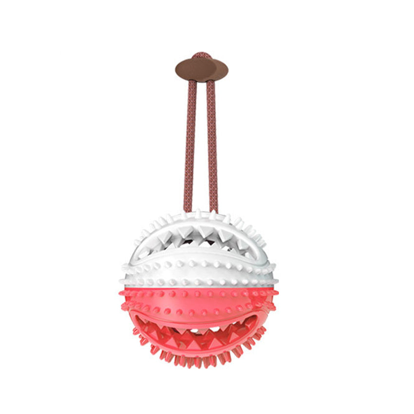 Dog chew ball toy with ridged white and red spiky ball and brown handle straps