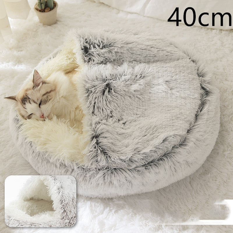 Grey round plush pet bed with shag lining, cat curled up inside.