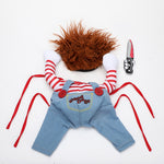 Dog Halloween costume flat lay: orange wig, striped arms, light-blue overalls, knife and red ties