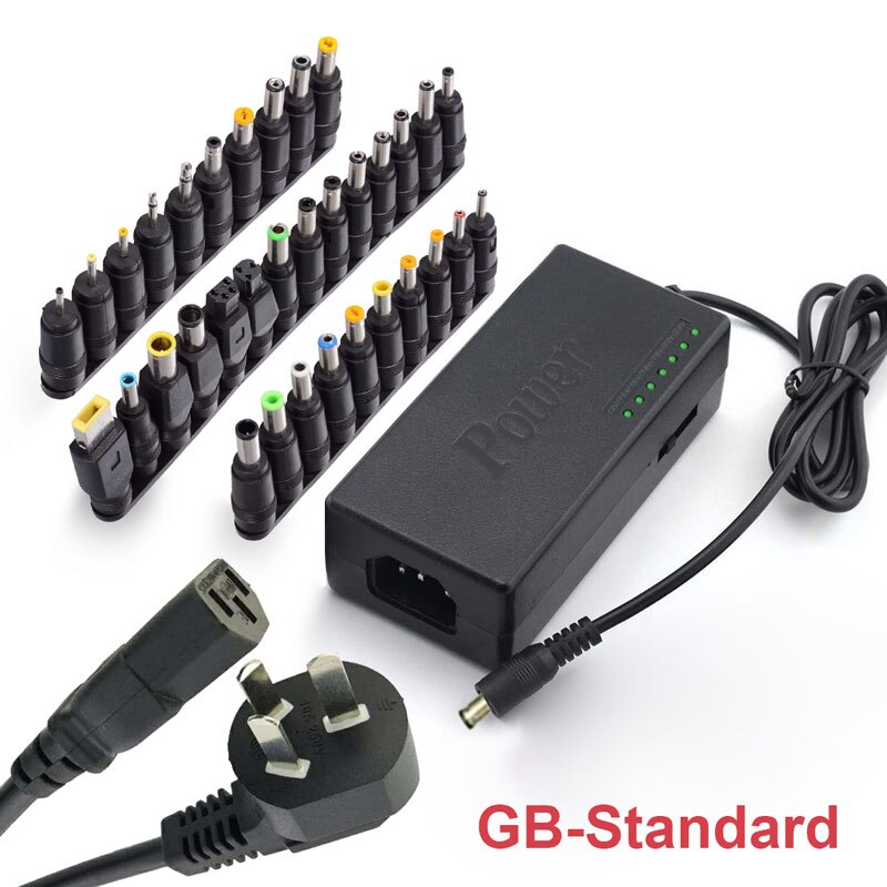 Universal power adapter with DC tip set, LED indicator lights, and UK-style plug
