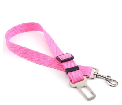 Adjustable dog car seat belt strap in pink with metal clips and buckle adjuster.