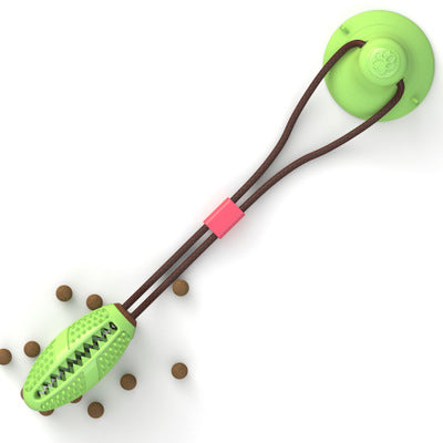 Green suction cup tug toy with spiky ball on brown cord