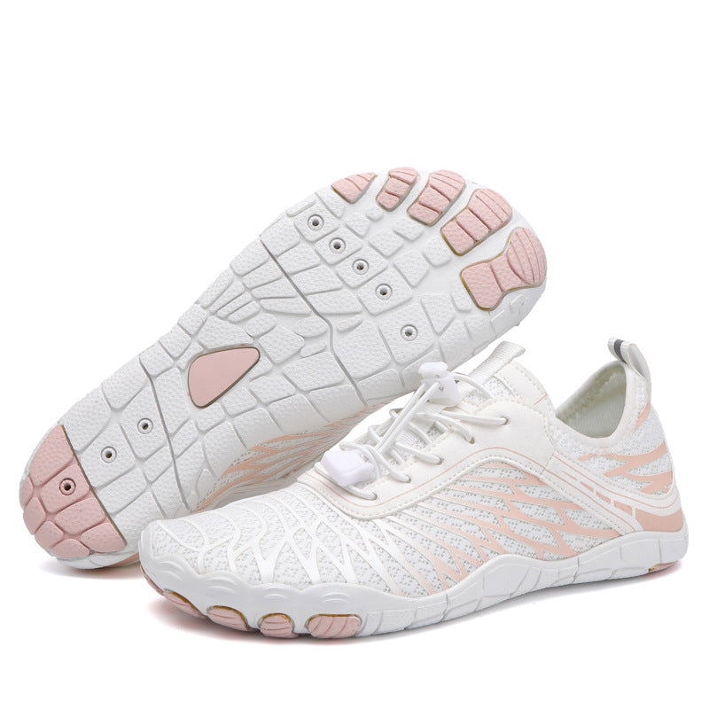 White water shoes with blush and aqua graphics, lace-up mesh upper, and tread sole.