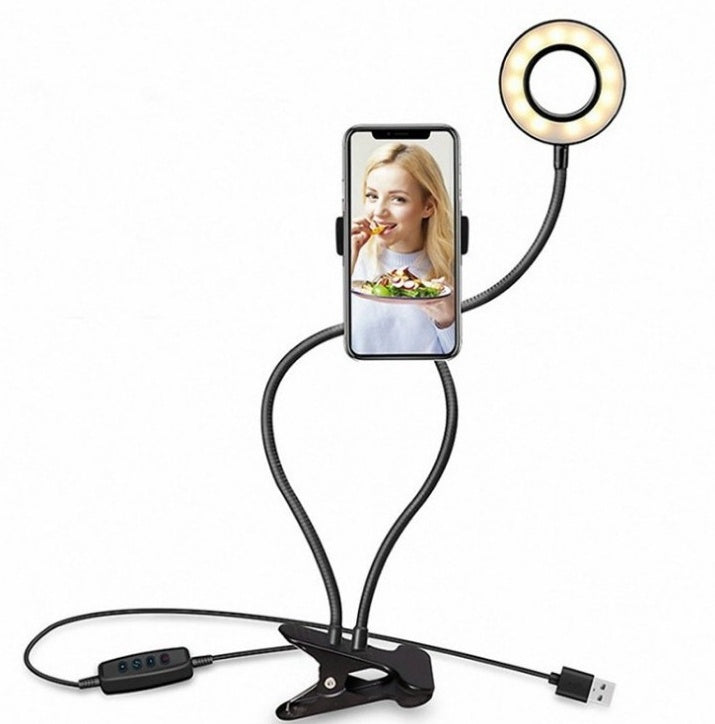 LED selfie ring light with warm glow, smartphone holder, and adjustable clip base