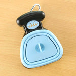 Blue foldable pet waste scooper with white center insert and black top