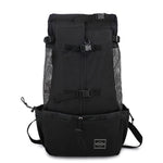 Black pet dog carrier backpack with mesh side panels and front storage pouch