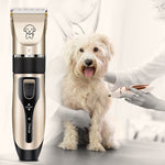 Rechargeable pet hair clipper with gold head, black grip, and adjustable comb guard