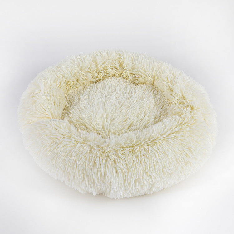 Round shaggy pet sleep bed in cream, with padded rim and inner lounging nest