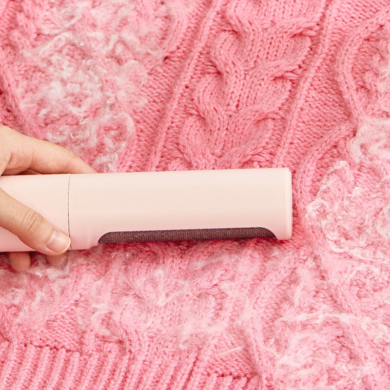 Reusable pet hair remover lint roller brush clearing pink knit sweater
