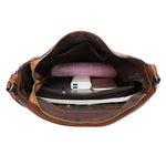 Brown hobo bucket bag open top with zipper, interior pocket and phone slot
