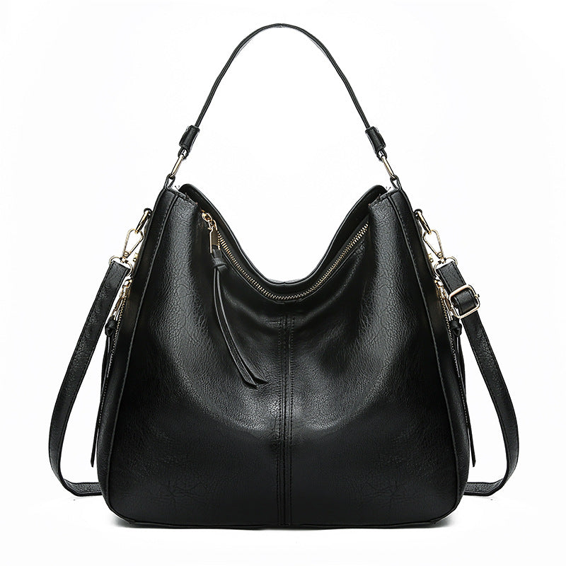 Black hobo bucket bag with zipper top and adjustable shoulder strap