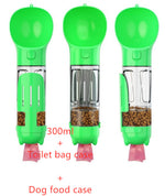 Green portable pet water bottle feeder with transparent food chamber and waste bag holder